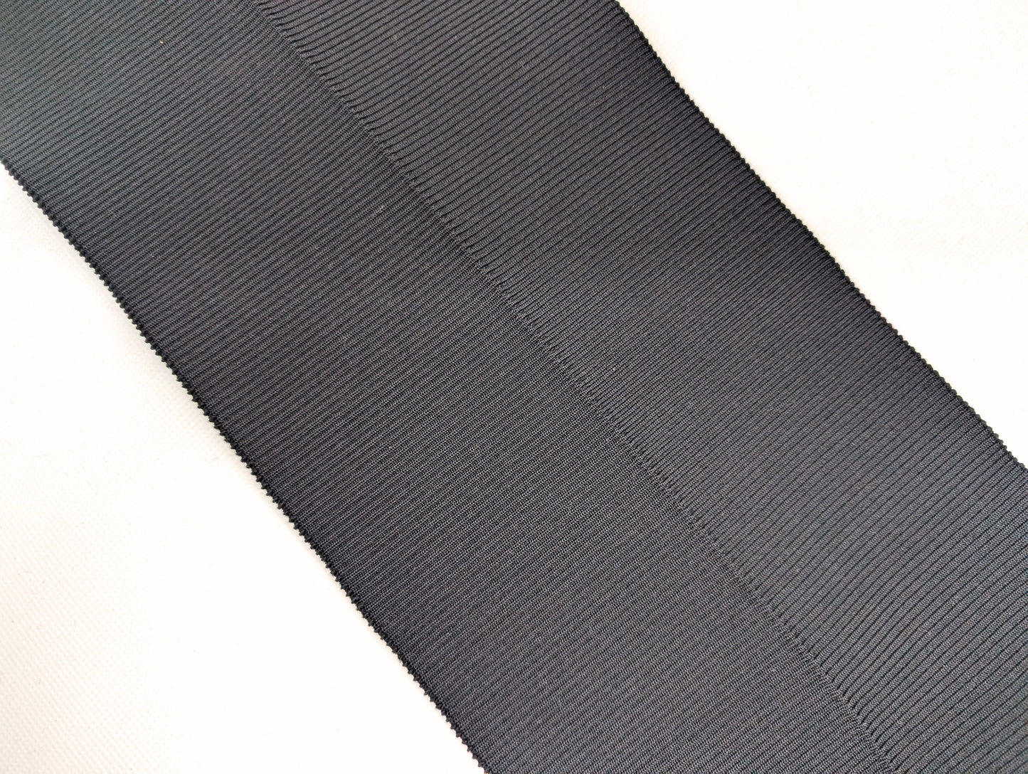 Bord-côte noir en polyester et élasthanne